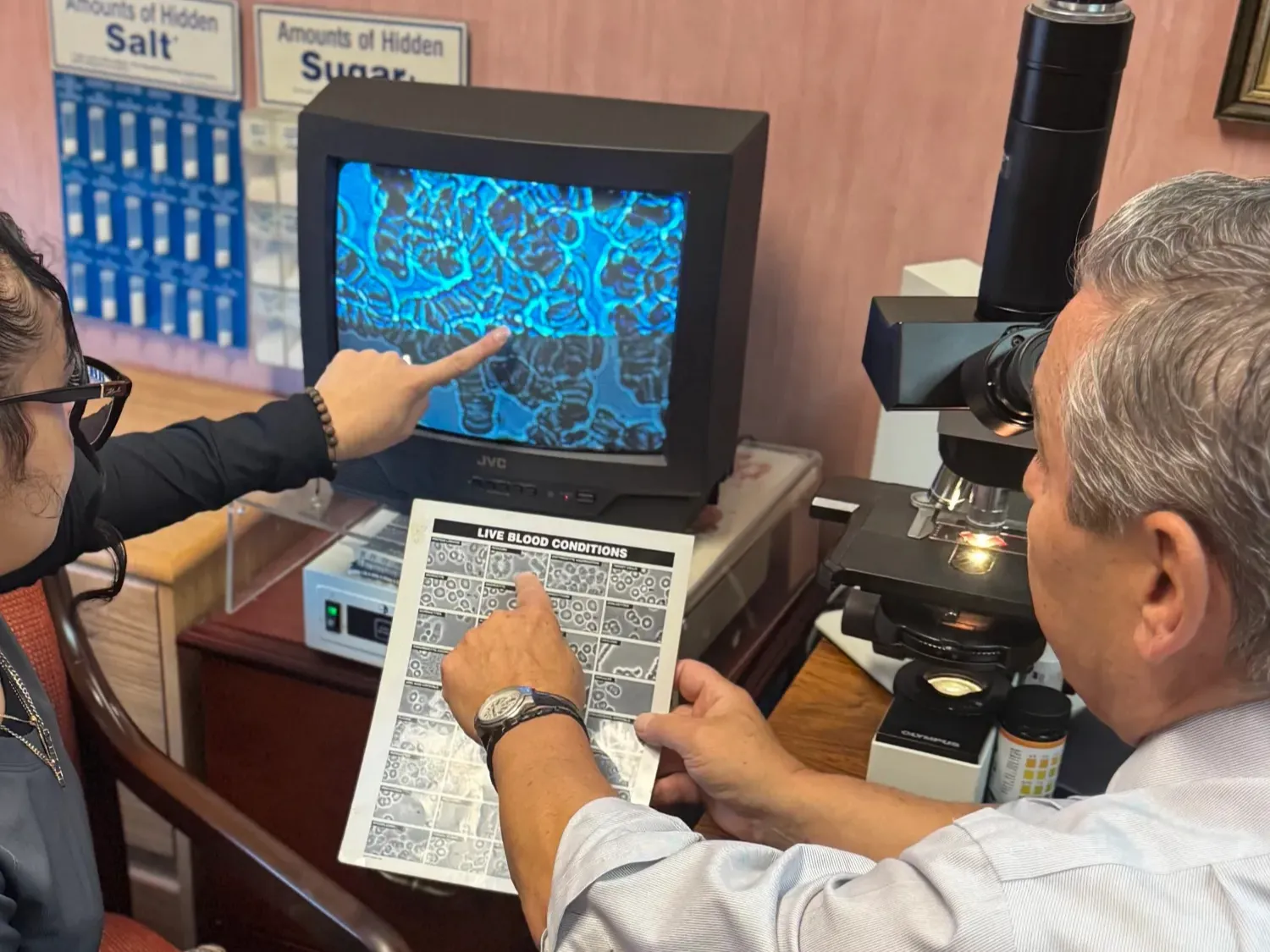 Dr and nurse pointing at screen Nutritional Response Technique